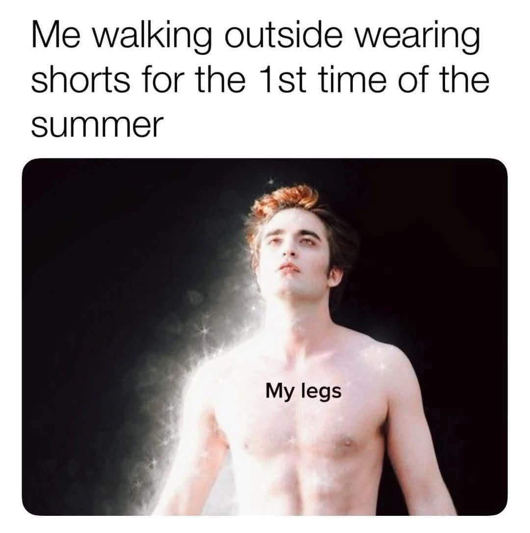 A cinematic frame of a glowing, sparkling Edward Cullen from Twilight pulled into a pop-culture meme dump, captioned "Me walking outside wearing shorts for the 1st time of the summer," with the text label "My legs" placed over his blindingly radiant torso.