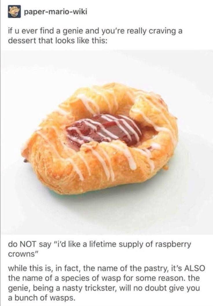 Close up of a flaky raspberry crown danish pastry pastry with white sugar icing drizzle.