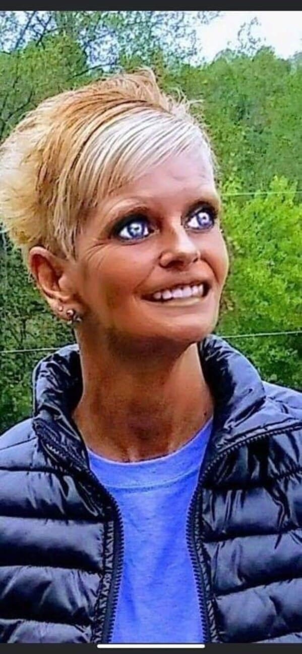close-up portrait of a woman processed through an aggressive face-tuning filter that over-sharpens her skin, giving her glowing neon blue eyes and a pasted-on smile in an uncanny valley photoshop fail.