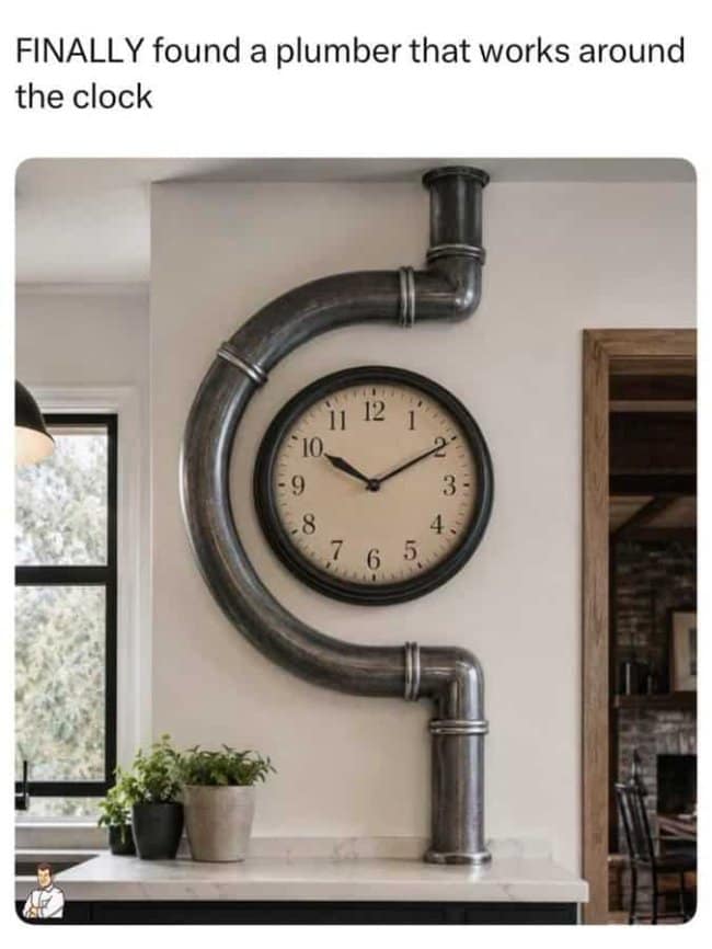 A cleanly shot punny meme presents a piece of modern industrial interior design with the text, "FINALLY found a plumber that works around the clock." The visual reveals a circular beige wall clock that is structurally surrounded by a thick, dark metallic plumbing pipe that curves perfectly around its left hemisphere.
