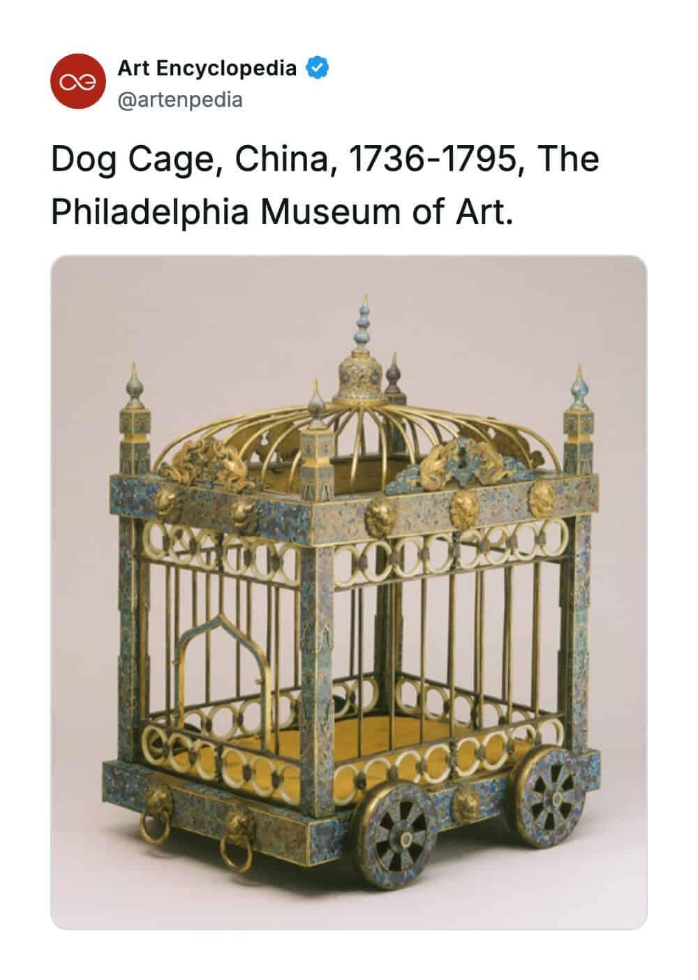 A rare historical photo displaying an exceptionally ornate Chinese dog cage from the Qianlong period (1736-1795), currently preserved at the Philadelphia Museum of Art. The wheeled cage resembles a miniature imperial palace, decorated with intricate cloisonne enamel in shades of turquoise, gold, and blue, featuring pillars and a vaulted dome roof.