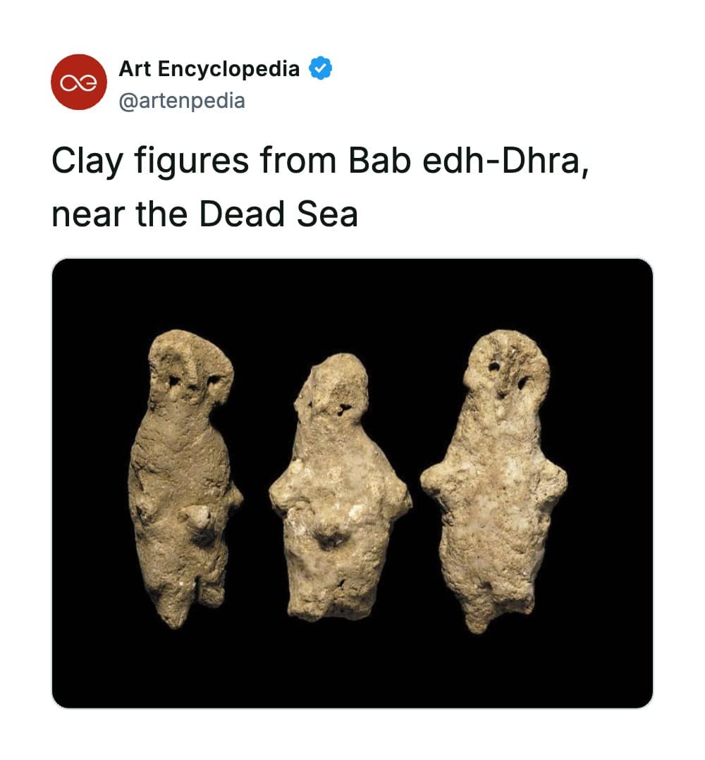 A rare historical photo exhibiting three ancient, primitive clay figurines discovered at the archaeological site of Bab edh-Dhra near the Dead Sea, displayed side-by-side against a solid black background, showcasing rough, highly stylized anthropomorphic features with hollowed-out eyes.