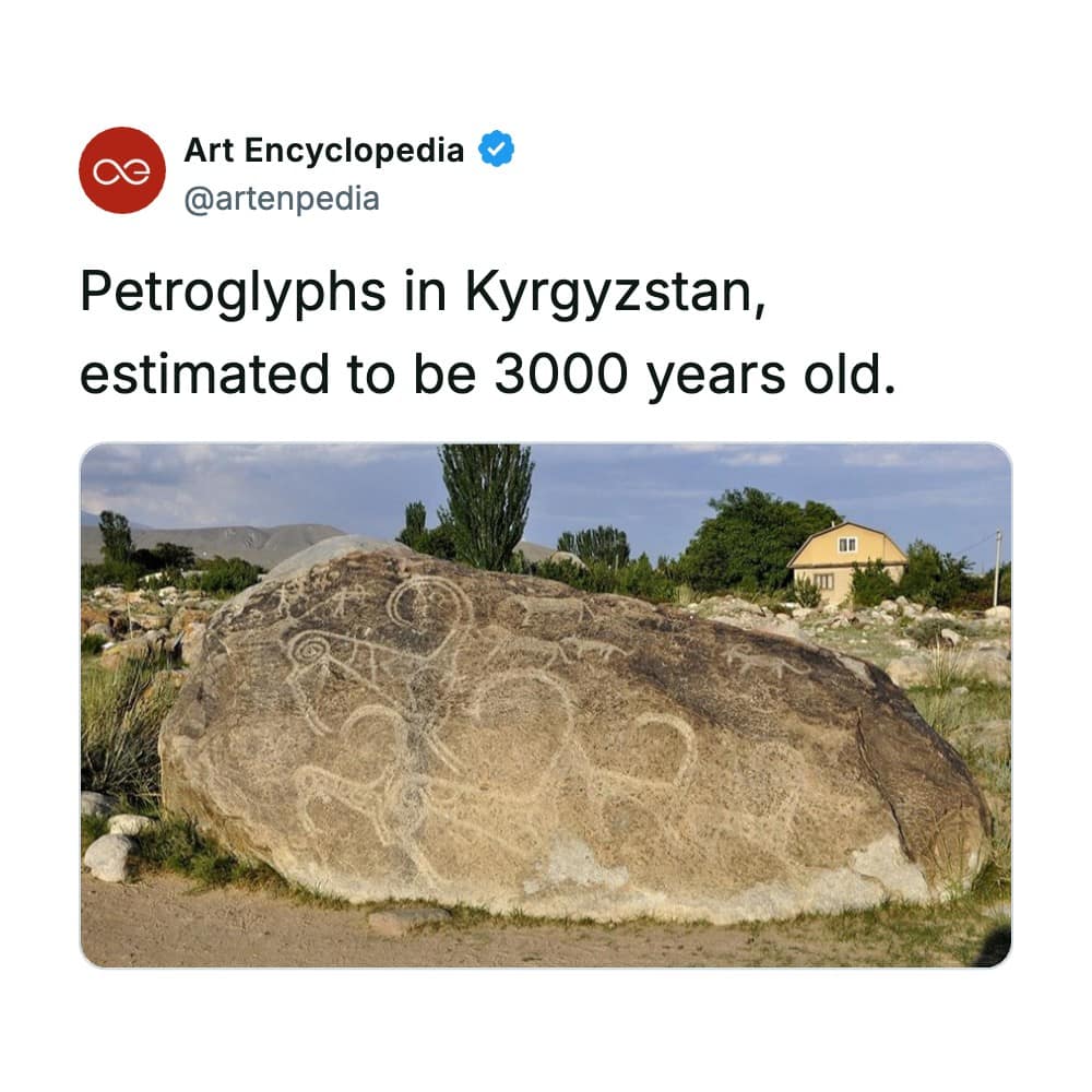 A rare historical photo of a massive, isolated boulder in Kyrgyzstan covered in 3,000-year-old petroglyphs, featuring deeply grooved lines outlining mountain goats and ibexes with large, sweeping curved horns.