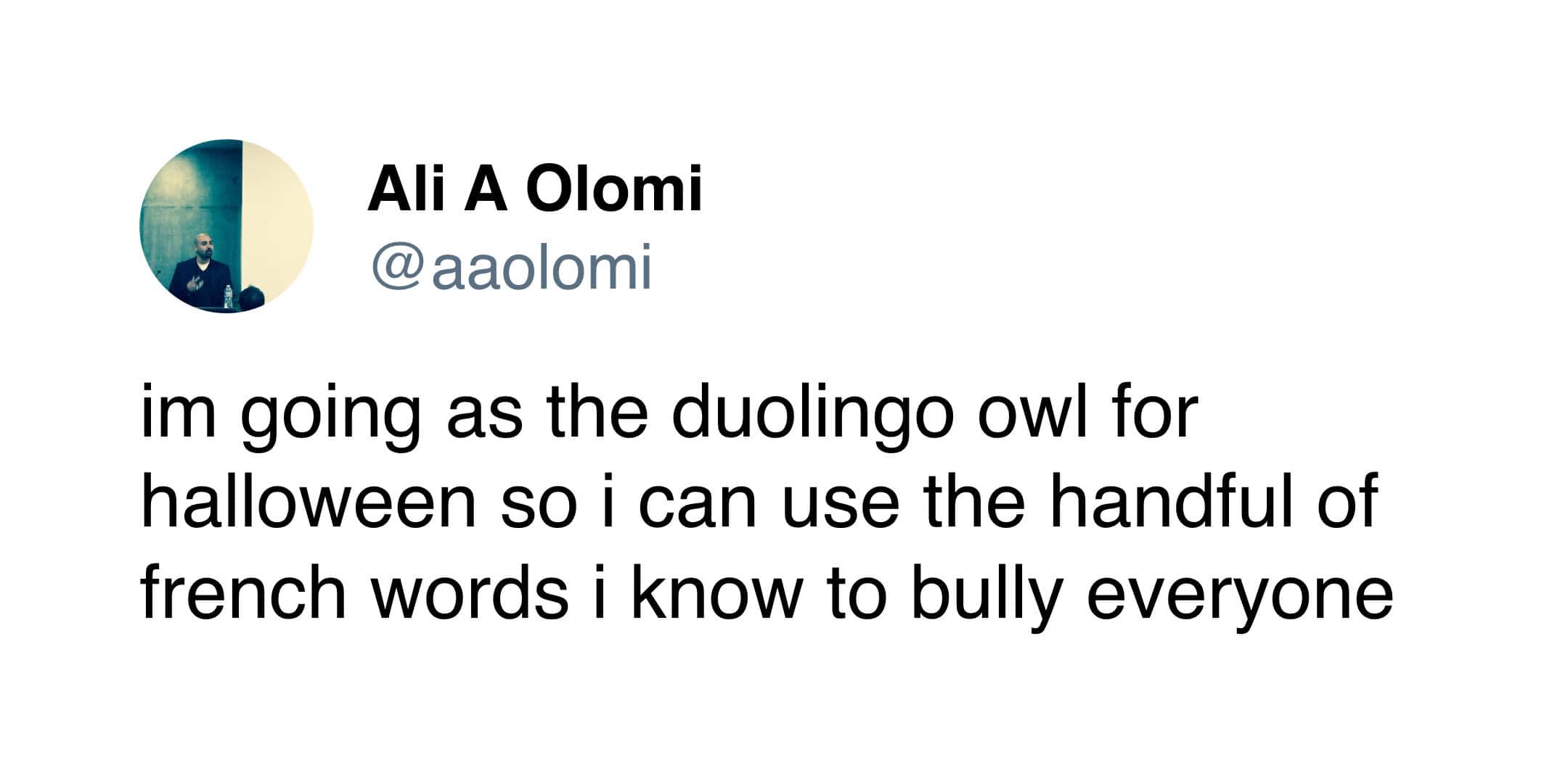 Tweet by aaolomi about dressing up as the green owl to harass people with French.