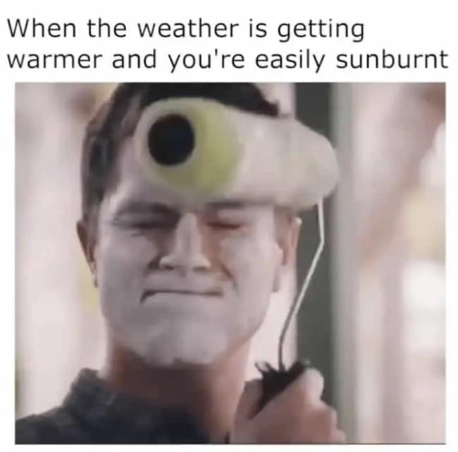Close-up of a man applying a thick layer of white sunblock cream to his face using a home paint roller in a relatable sunburn meme.