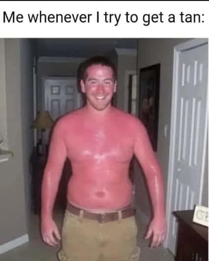 A hallway snapshot of a smiling, shirtless man covered head-to-toe in an intensely bright, glowing neon-crimson sunburn under relatable text inside a sunburn meme.