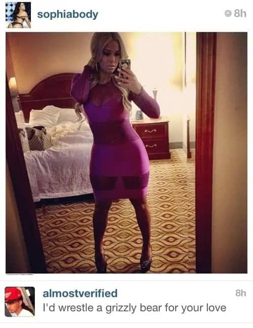 Sophiabody posing in a purple bandage dress with a comment offering to wrestle a grizzly bear.