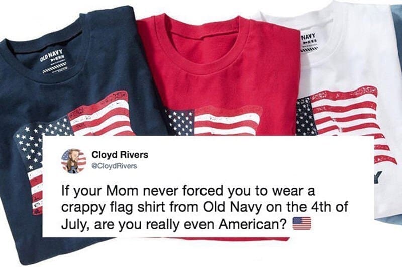 This nostalgic 4th of july meme hits on a universal childhood holiday ritual with a social media post from Cloyd Rivers. The text asks, "If your Mom never forced you to wear a crappy flag shirt from Old Navy on the 4th of July, are you really even American? 🇺🇸", superimposed directly over a clean pile of Old Navy's signature graphic flag tees in navy blue, red, and white.