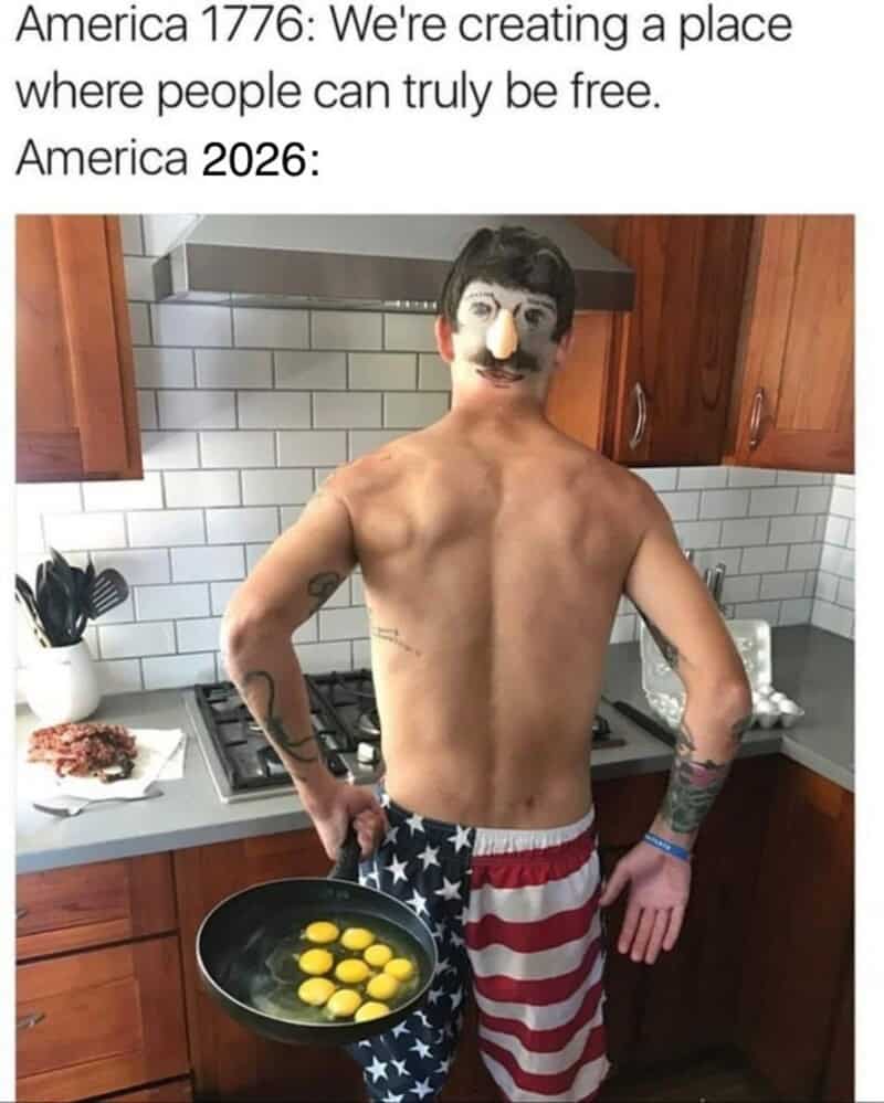 An absurdly chaotic 4th of july meme details a 250-year evolutionary timeline comparing early American ideals to modern reality. The text contrasts "America 1776: We're creating a place where people can truly be free" with "America 2026:", visualized by a shirtless man in a kitchen wearing a Groucho Marx disguise mask and American flag swim shorts while holding a frying pan full of raw egg yolks.