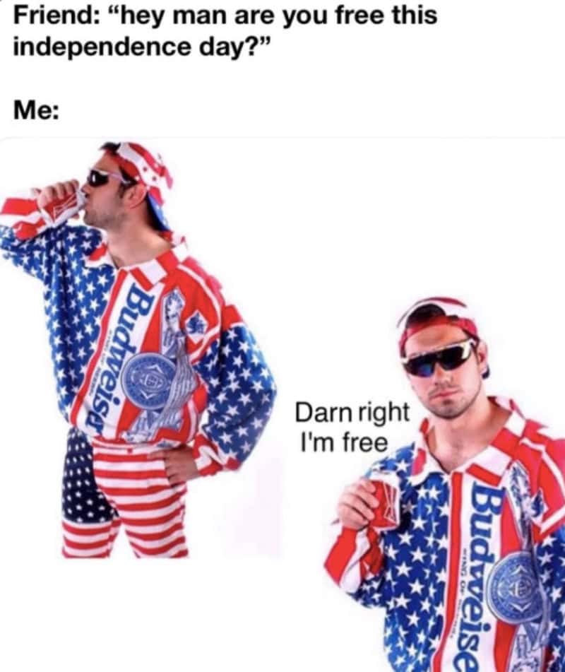 patriotic 4th of july meme showcases a two-panel text setup poking fun at American holiday availability. The prompt reads, "Friend: 'hey man are you free this independence day?' Me:", followed by a full-length photograph of a man posing proudly in a complete American flag and Budweiser logo windbreaker tracksuit and sunglasses, holding a beer and stating: "Darn right I'm free."