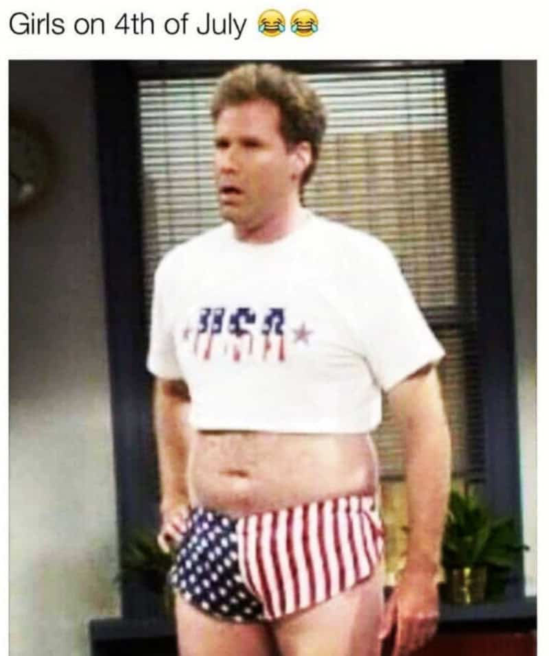 An ironic 4th of july meme pokes fun at summer fashion trends using a vintage television screenshot. The caption "Girls on 4th of July 😂😂" is paired with a low-resolution image of Will Ferrell from Saturday Night Live looking thoroughly confused while standing in an office wearing a tiny, midriff-baring white "USA" crop top and matching tight American flag short-shorts.
