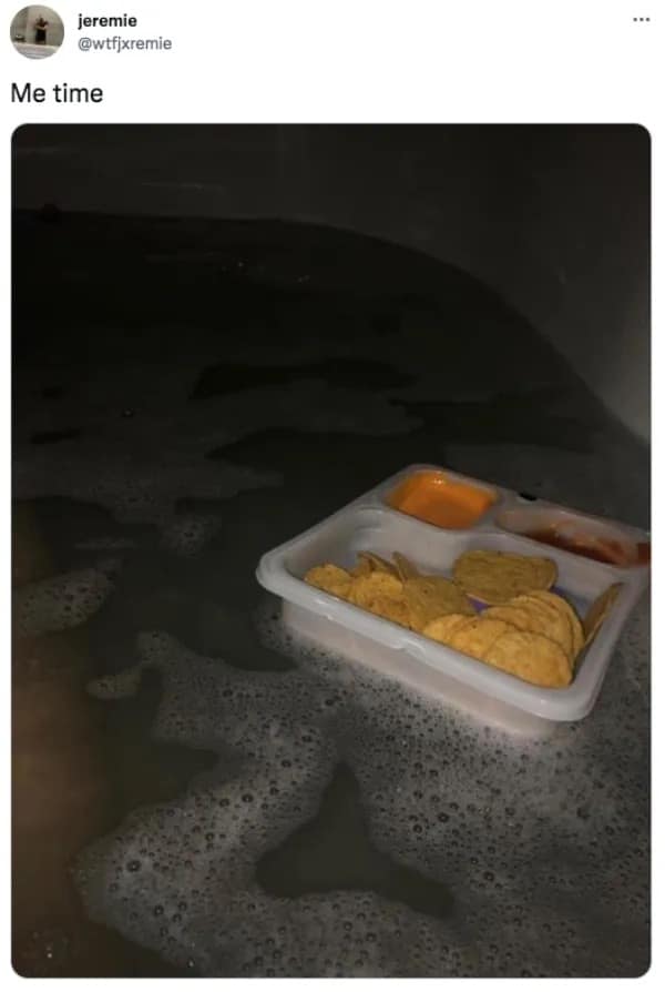 A peak self-care presentation added to the best memes gallery shows a plastic nacho and cheese dip Lunchables tray floating perfectly level on top of a dark, relaxing bubble bath.