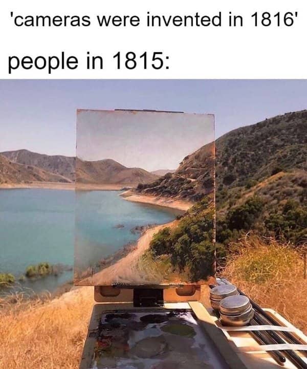 Landscape painting on an easel perfectly blending into the actual mountain and lake scenery behind it.