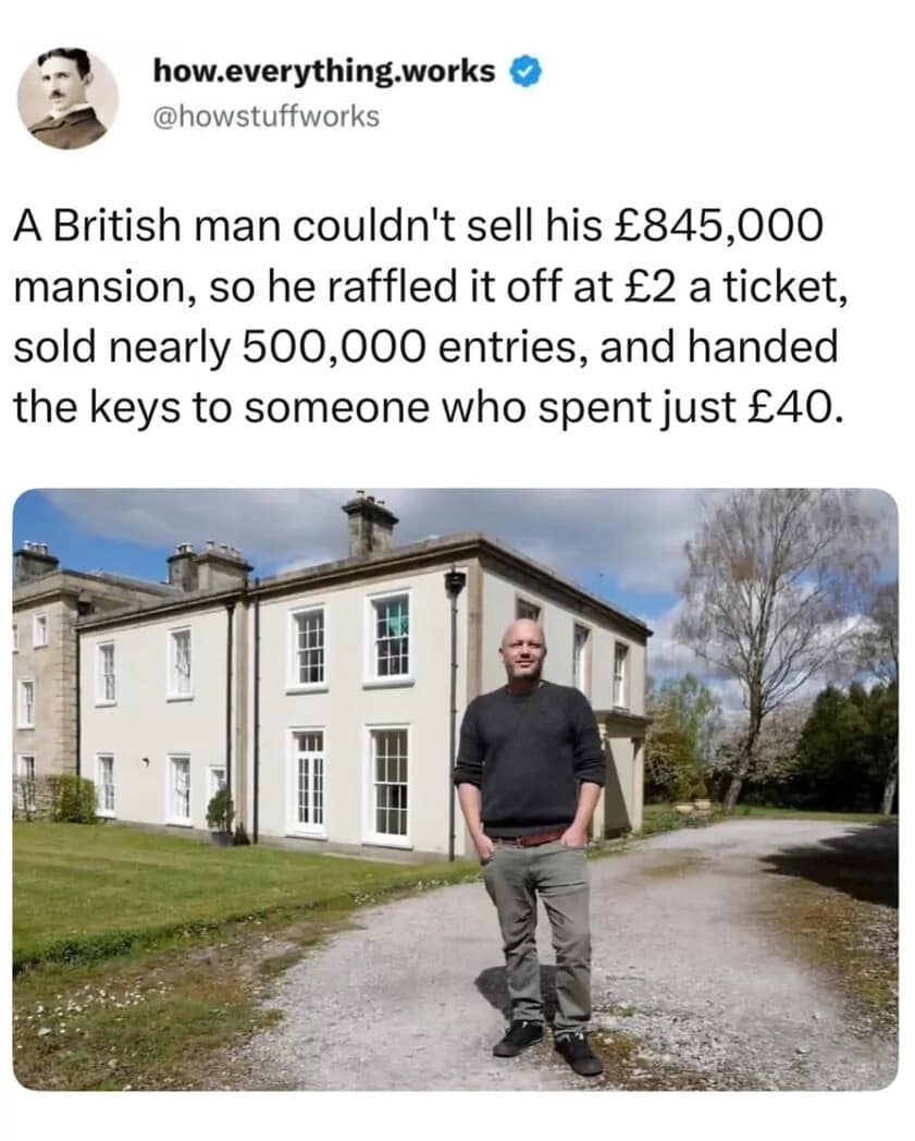 A fascinating real estate news snippet format showcasing a British homeowner standing proudly in front of his massive white stone estate after successfully bypassing a stagnant housing market by raffling it off for £2 per ticket.