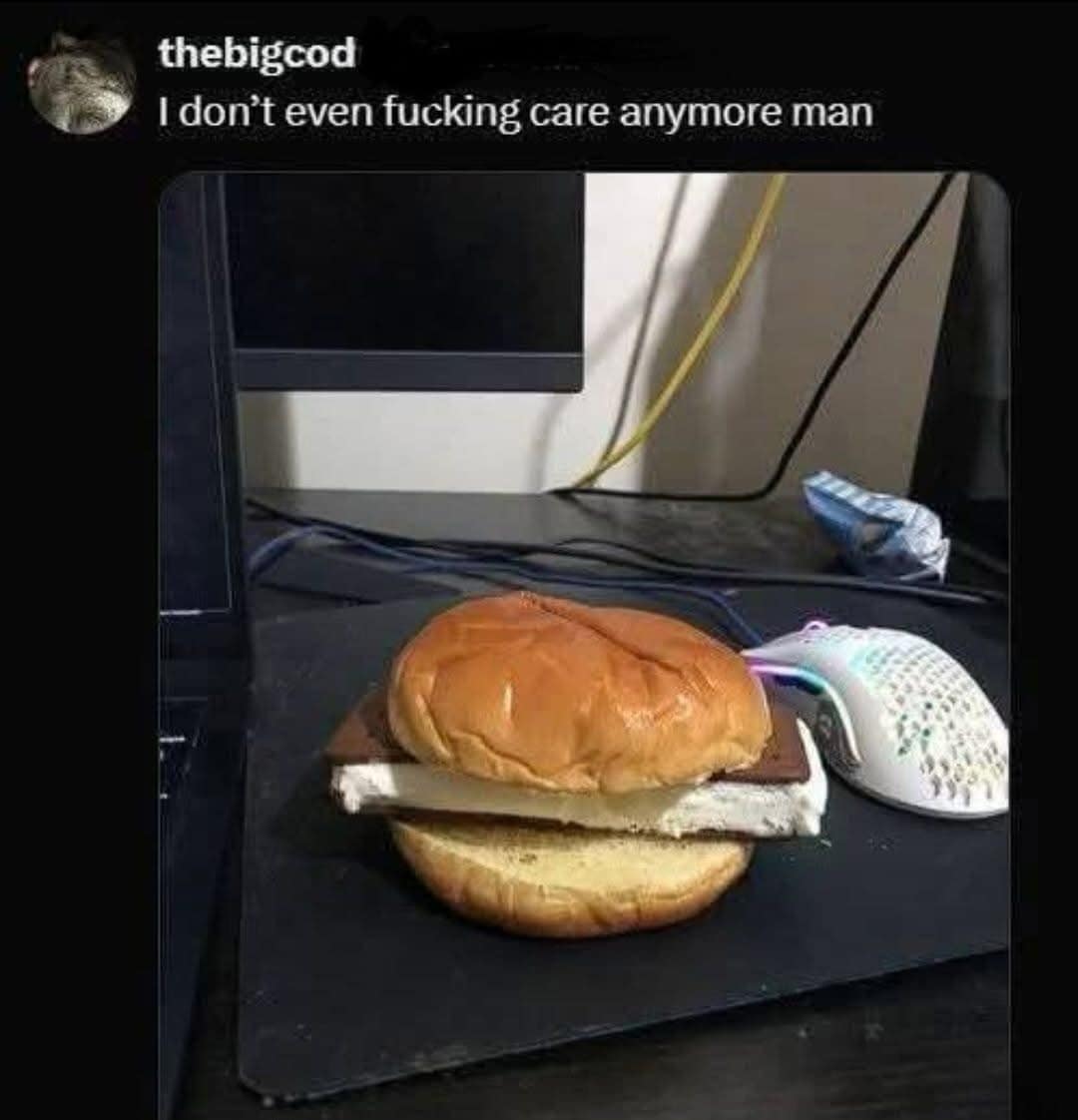 A cursed food layout functions as a classic meme showing an ice cream sandwich stuffed directly between a regular hamburger bun on a gaming mousepad.