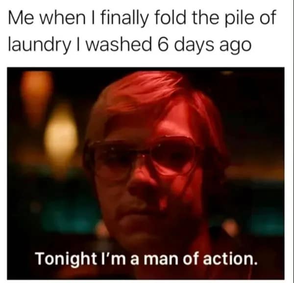 A dramatic television screen grab used as a classic meme, featuring a character lit in deep red room light stating "Tonight I'm a man of action," representing the sudden motivation to fold 6-day-old laundry.