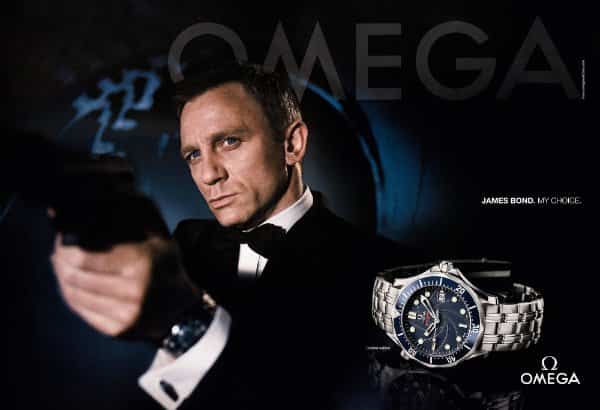 Omega luxury watch creative ad featuring Daniel Craig as James Bond pointing a handgun.