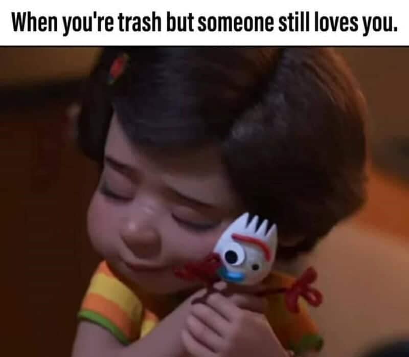 An emotional Disney meme shows Bonnie hugging the homemade spork Forky under text about being loved despite being trash.