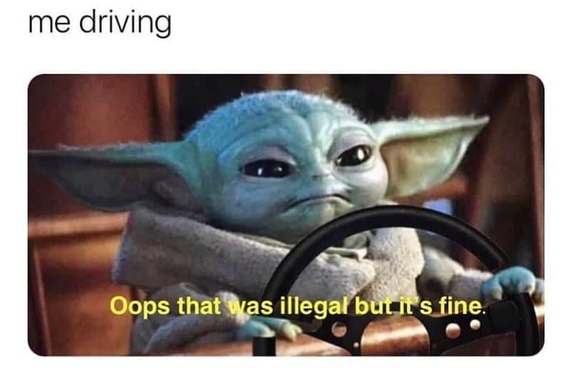 A viral driving meme showing Baby Yoda (Grogu) gripping a steering wheel with a guilty expression, captioned with a casual admission that a traffic maneuver was highly illegal but "it's fine."