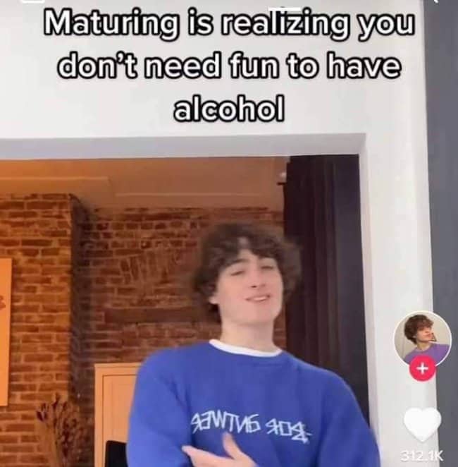 Selfie of young person declaring maturity means not needing fun for alcohol dark meme.