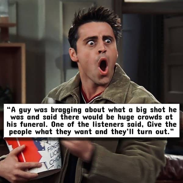 Matt LeBlanc as Joey Tribbiani reacting with extreme shock while holding a bucket of popcorn.