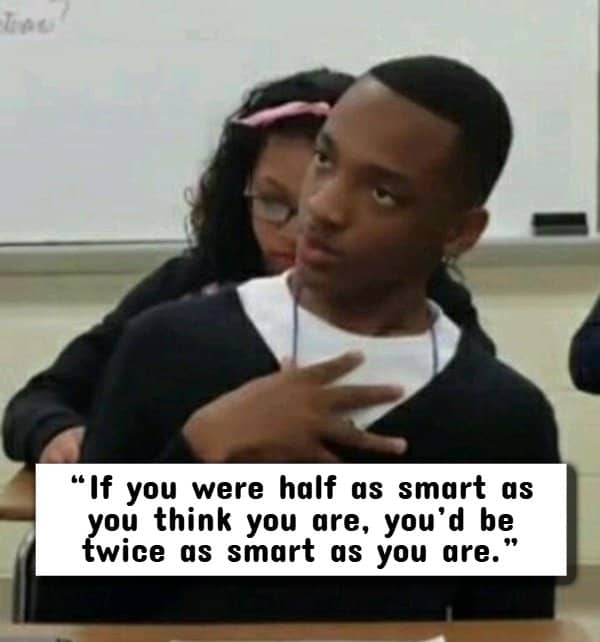 Classroom student pointing at himself in disbelief, illustrating a classic burn about perceived intelligence.
