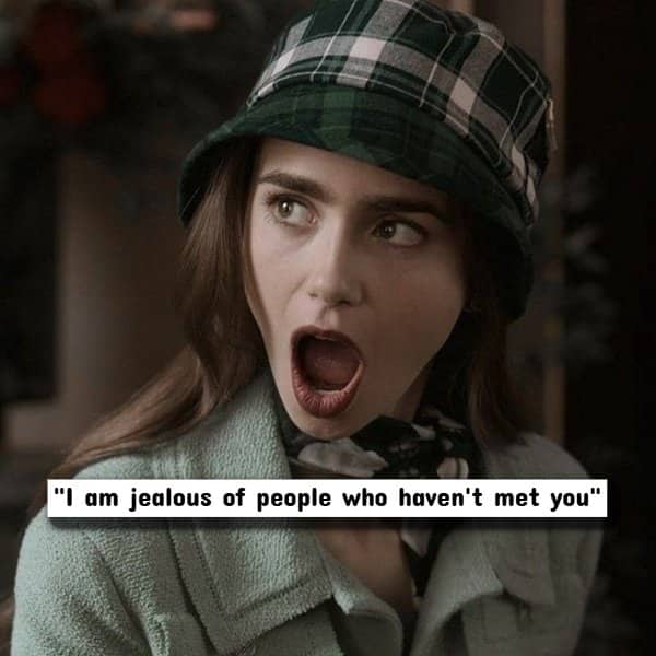 Lily Collins wearing a green plaid hat with an outraged, wide-mouthed expression of shock.