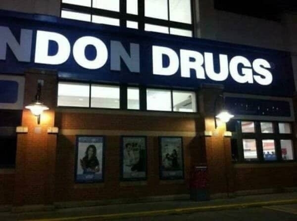 Broken London Drugs neon storefront sign with only the word NDON DRUGS lit up.