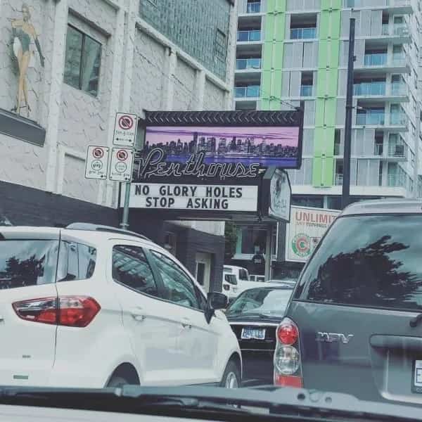 Funny memes sign at a venue sternly telling customers to stop asking inappropriate questions.