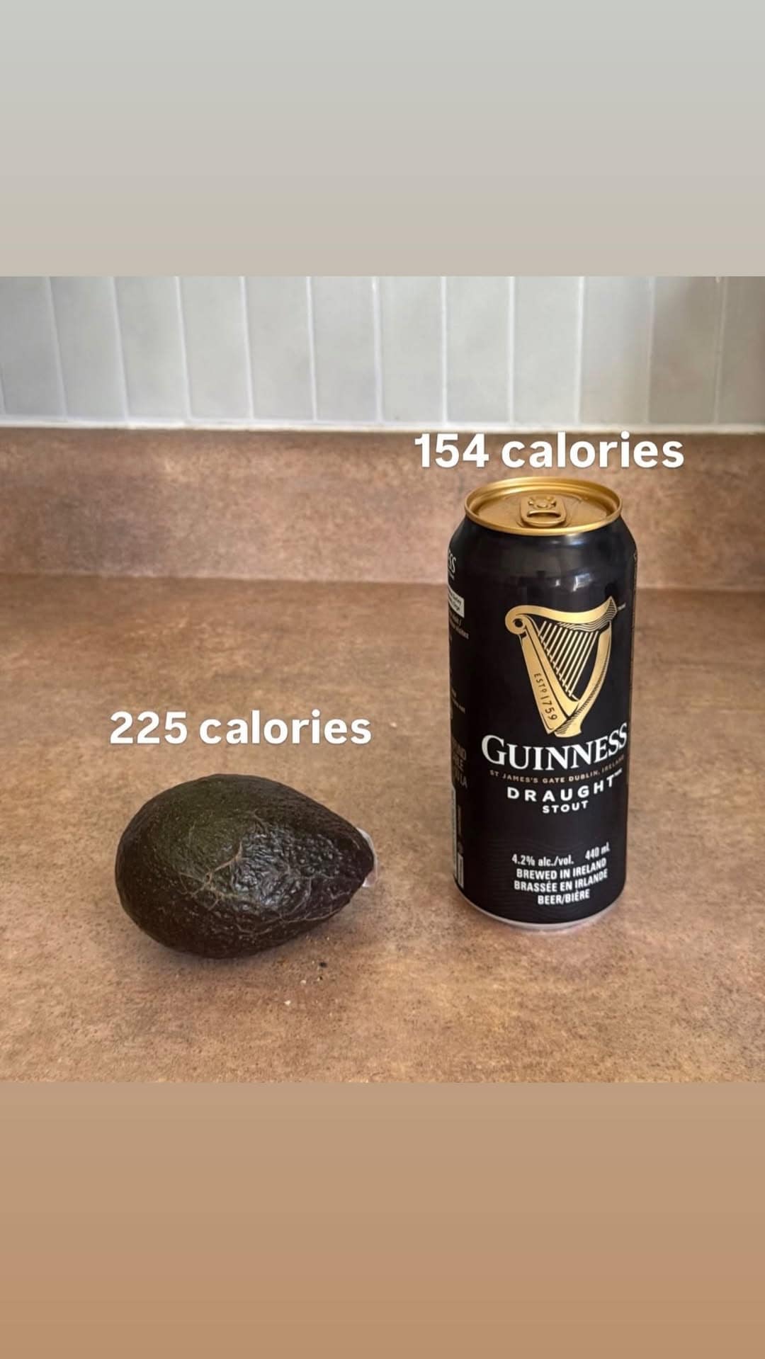 This dietary meme dump post compares the lower calories of a pint of Guinness stout to a higher-calorie whole avocado.