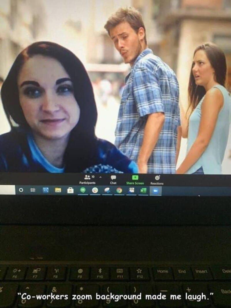 This workplace-themed funny meme shows a laptop screen during a corporate Zoom video call where an employee has set their custom virtual background to the classic distracted boyfriend meme template.
