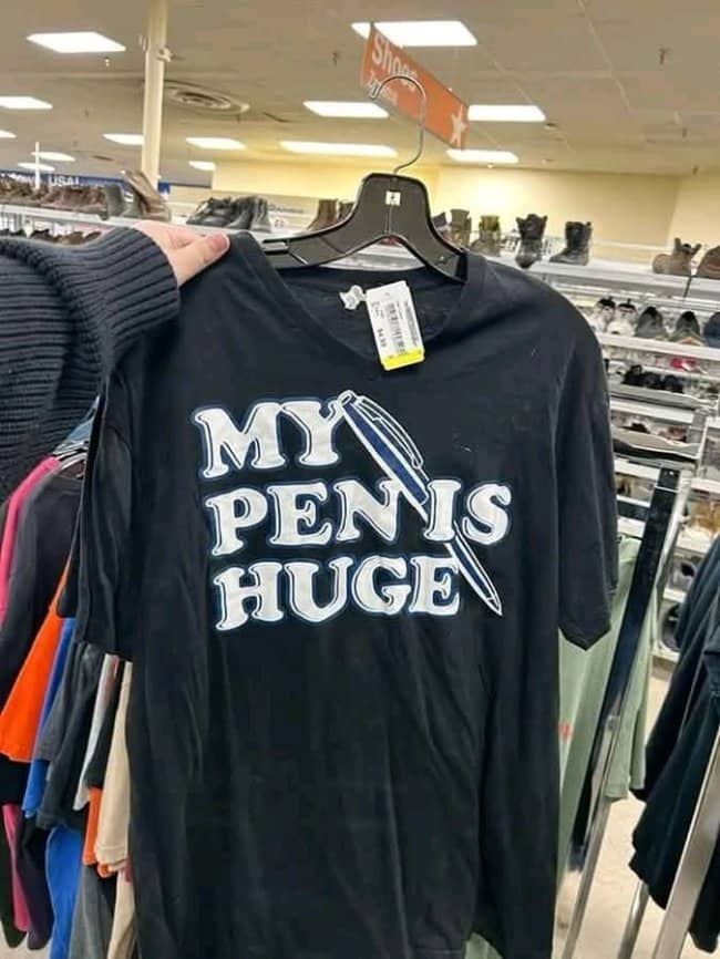 Black thrift store shirt reading my pen is huge showing design fails in funny outfits.