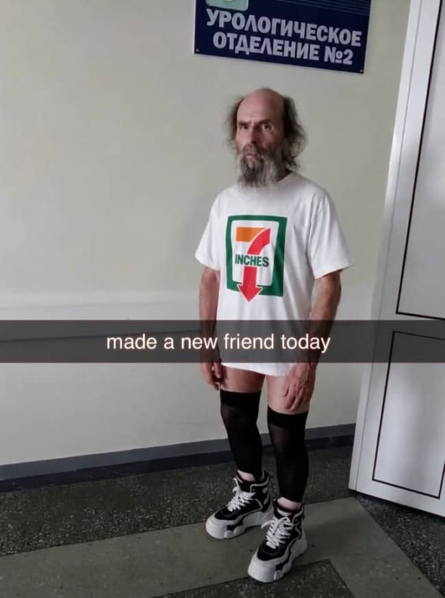 Man in knee-high stockings and seven-inch arrow t-shirt showcasing chaotic designs in funny outfits.