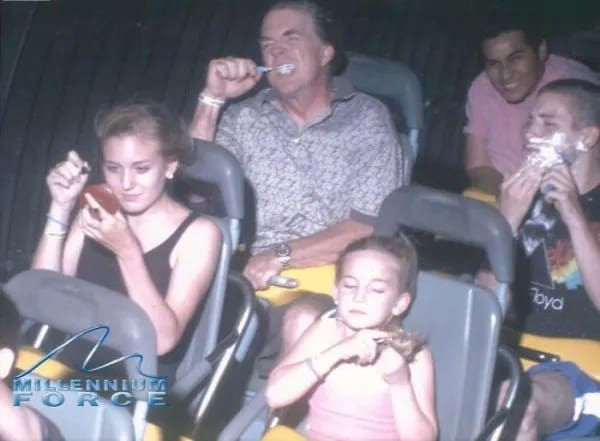 Amusement park riders staging a morning routine with shaving cream, a toothbrush, and makeup on Millennium Force.