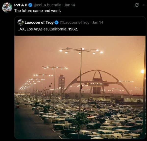 Vintage photo of LAX Theme Building in 1962 surrounded by a massive parking lot.