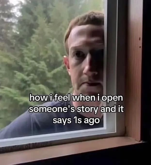 This highly expressive funny meme features a viral close-up still of Meta CEO Mark Zuckerberg peering intensely through a glass window pane from the outside. The image is framed by a text layer capturing social media paranoia: "how i feel when i open someone's story and it says 1s ago".