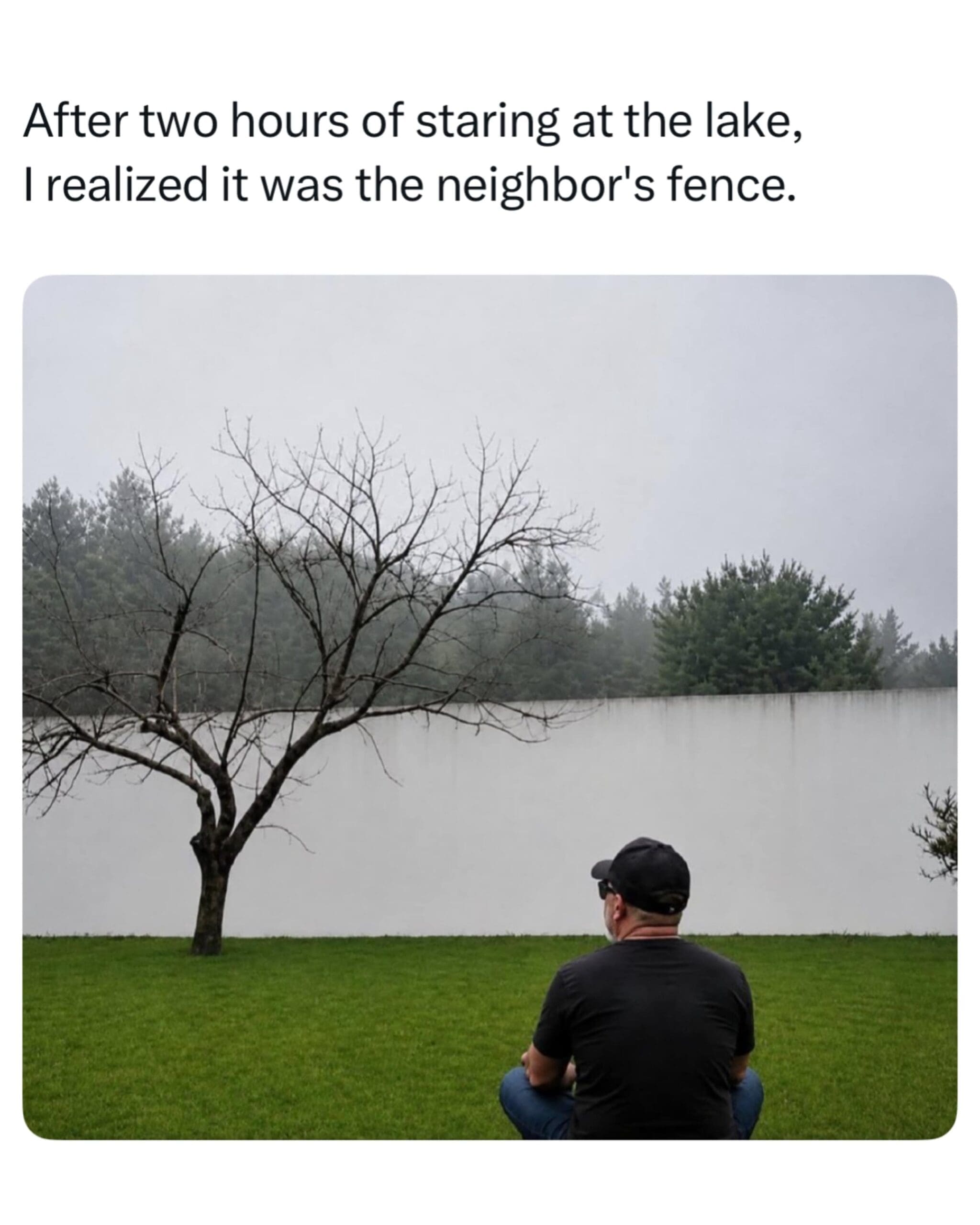 A mind-bending optical illusion in this meme dump shows a man sitting on grass staring at a white concrete wall that looks exactly like a foggy lake horizon against a grey sky.