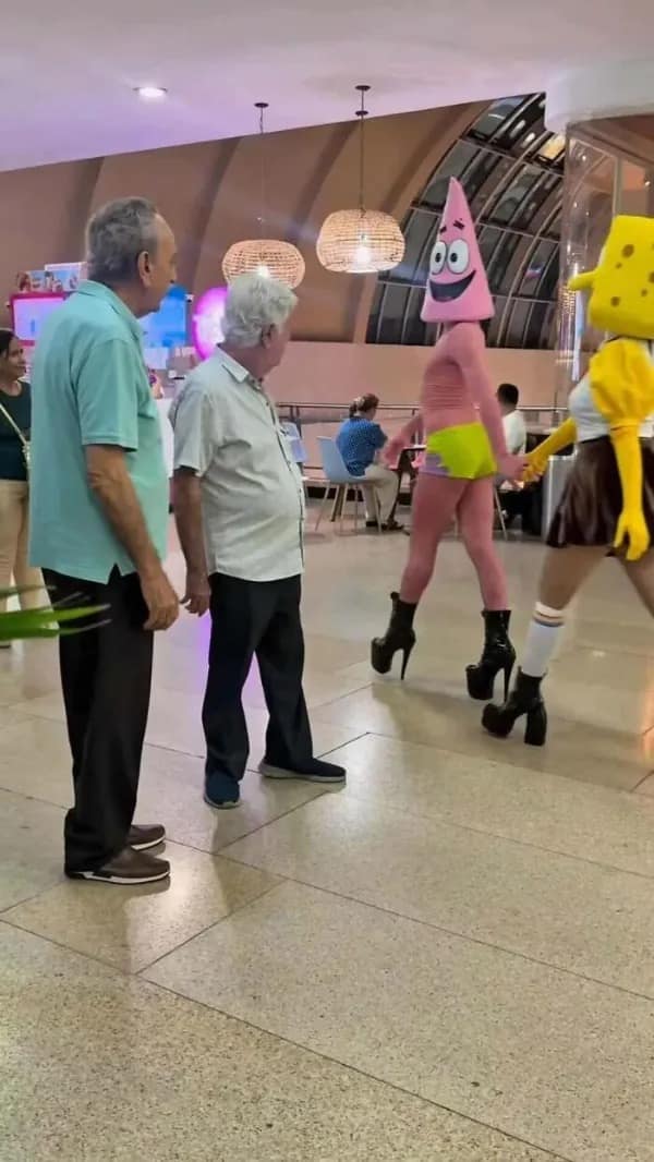 A hilarious real-life format in our meme dump captures two older men turning around in complete disbelief to watch people dressed as Patrick Star and Spongebob strutting down a hall in massive high-heeled platform boots.