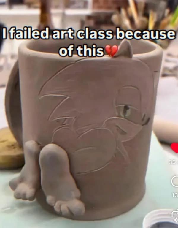 A cursed pottery studio image in the meme dump shows a clay coffee mug engraved with Sonic the Hedgehog's profile, uniquely finalized with hyper-realistic human clay feet protruding from the bottom.