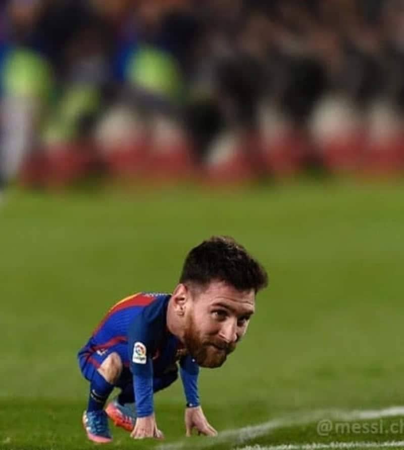 A funny edit of a tiny Lionel Messi with an oversized head squatting on the pitch.
