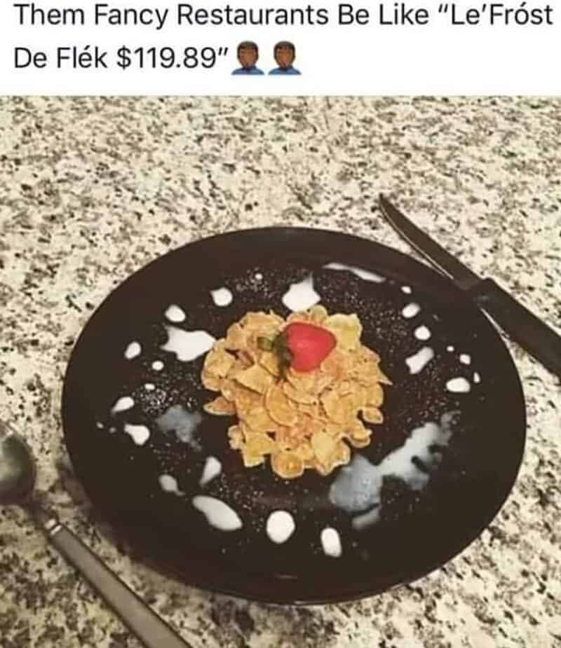 Plated frosted cornflakes with milk droplets and strawberry parodying high-end Michelin star food memes.