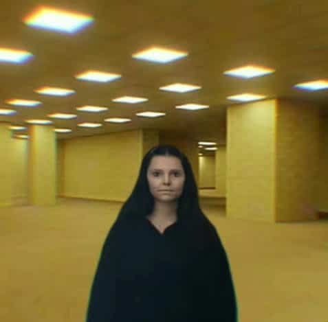 Thriller character edited standing inside yellow liminal Backrooms wallpaper room in Obsession memes.