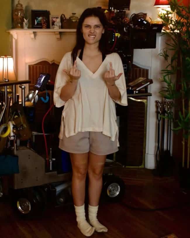 Actress making funny faces and middle fingers on set during filming in Obsession memes.