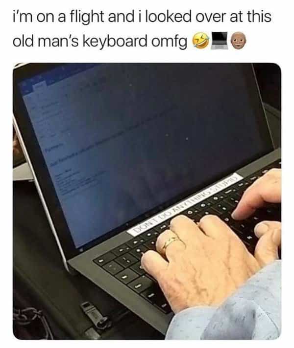 Laptop keyboard with a printed label reminding the user not to do anything stupid.