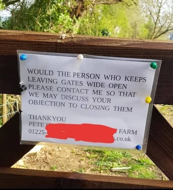 Printed notice pinned to a wooden gate asking the person leaving it open to discuss objections.
