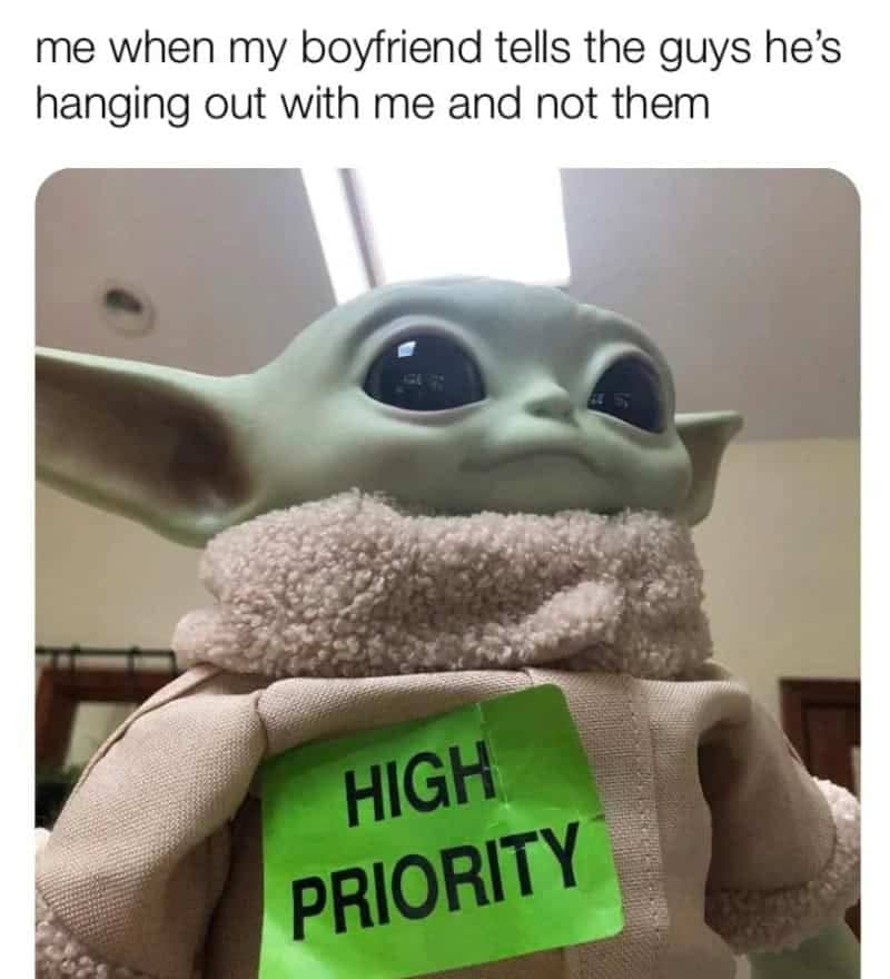 Baby Yoda plush wearing a high priority tag representing a girlfriend feeling special.