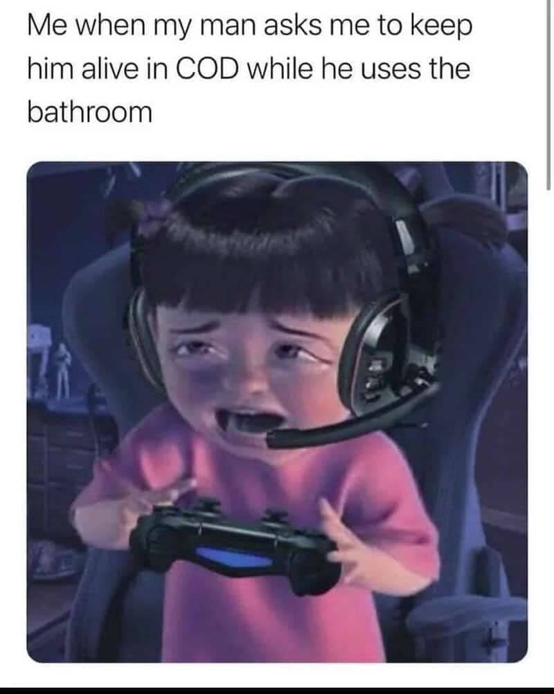 Meme of Boo from Monsters Inc wearing a headset holding a controller in absolute panic.