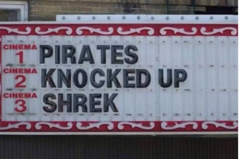 A movie theater marquee sign with a funny layout reading Pirates Knocked Up Shrek.