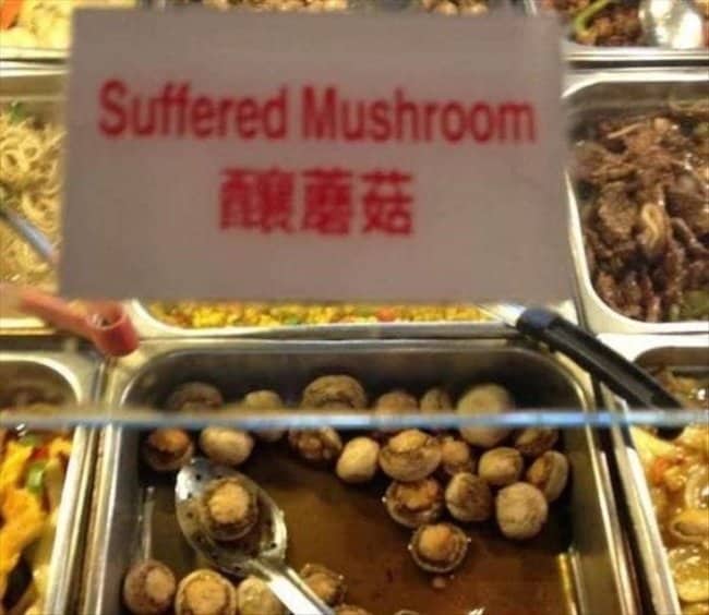 A metal buffet tray label displaying a translation fail that reads "Suffered Mushroom."