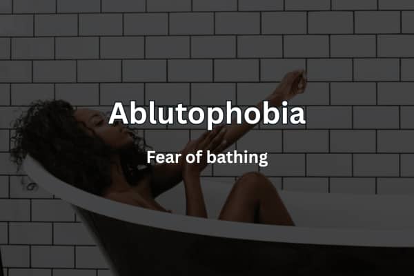 Text overlay defining Ablutophobia as the fear of bathing over a woman in a bathtub.